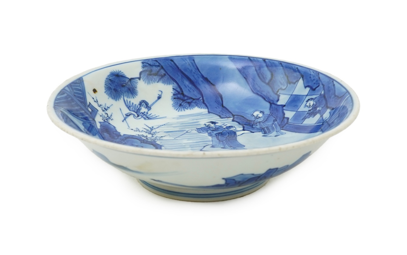 A Chinese blue and white saucer dish, Kangxi six character mark and of the period (1662-1722)
